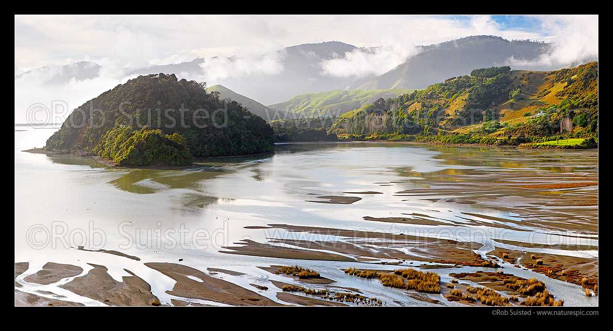 Image of Bishop Peninsula in Delaware Bay Lagoon. Maori Pa Beach isthmus and Delaware Bay far left with coastal hills and distant Bryant Range beyond in mist. Panorama, Cable Bay, Nelson City District, Nelson Region, New Zealand (NZ) stock photo image