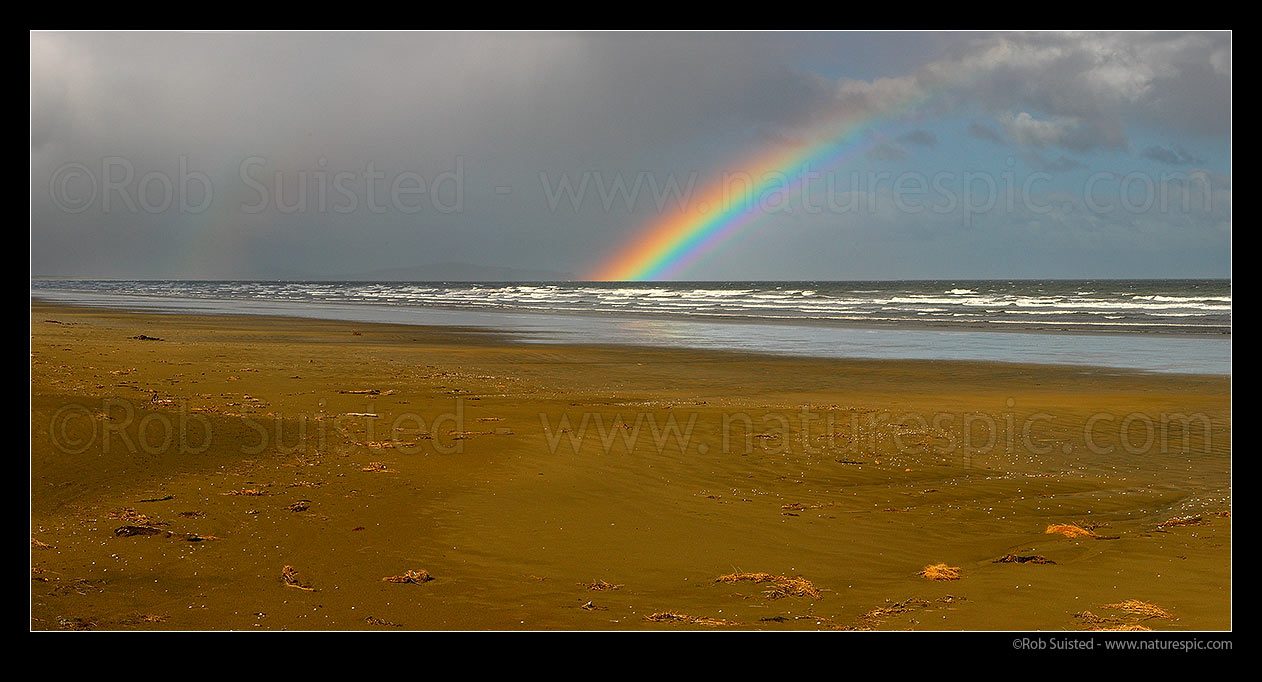 Image of Oreti Beach, sand dunes and rainbow at Waimatuku Stream mouth, between Invercargill and Riverton. Panorama, Oreti Beach, Southland District, Southland Region, New Zealand (NZ) stock photo image