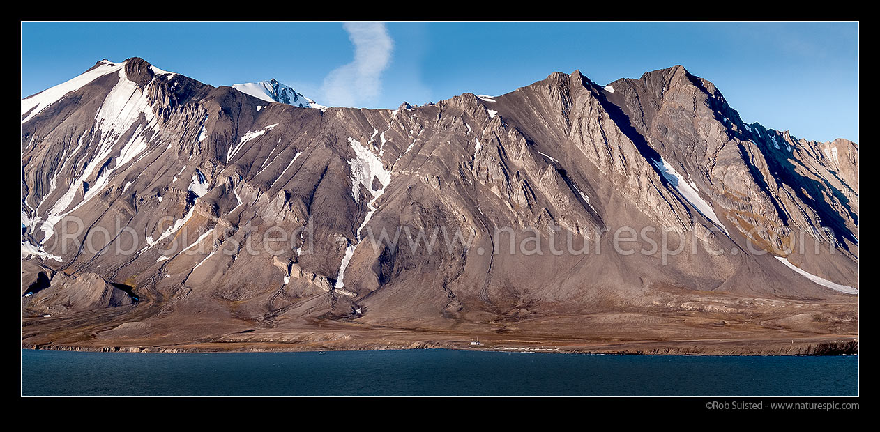 Image of West Spitsbergen landscape with a tortured rock landscape. Old hunting camp visible. Panorama, Forland Sundet, Svalbard stock photo image