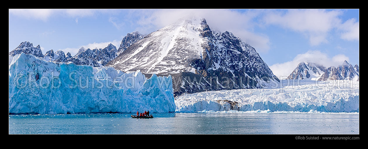 Image of Monacobreen Glacier with zodiac boat of visitors, Liefdefjorden, North West Spitsbergen. Panorama, Monacobreen, Svalbard stock photo image