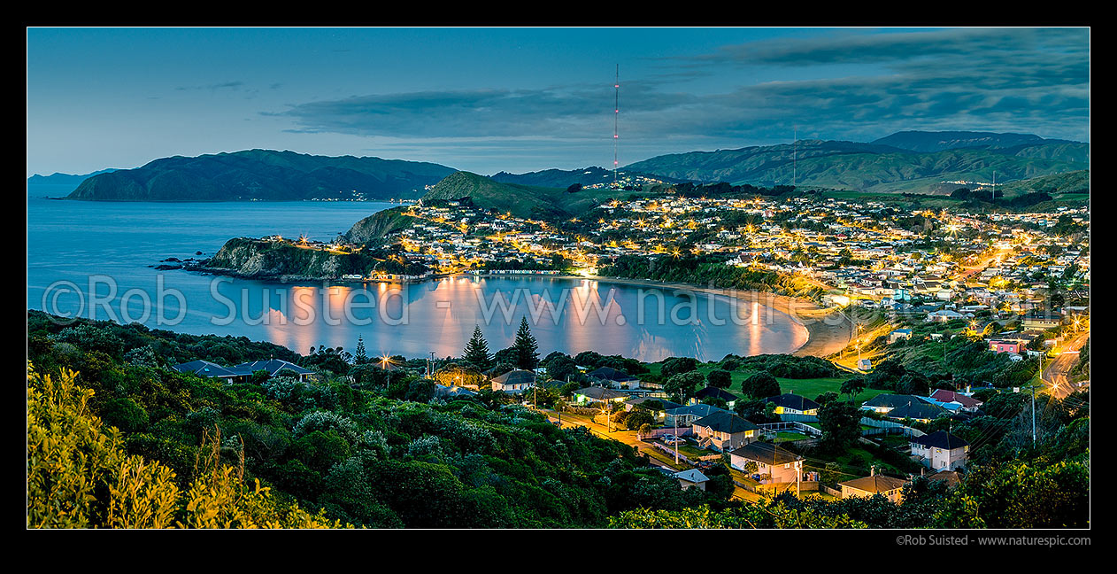 Image of Titahi Bay beach and suburb twilight panorama. Kapiti Island and Te Rewarewa Point far left, Titahi Bay, Porirua City District, Wellington Region, New Zealand (NZ) stock photo image