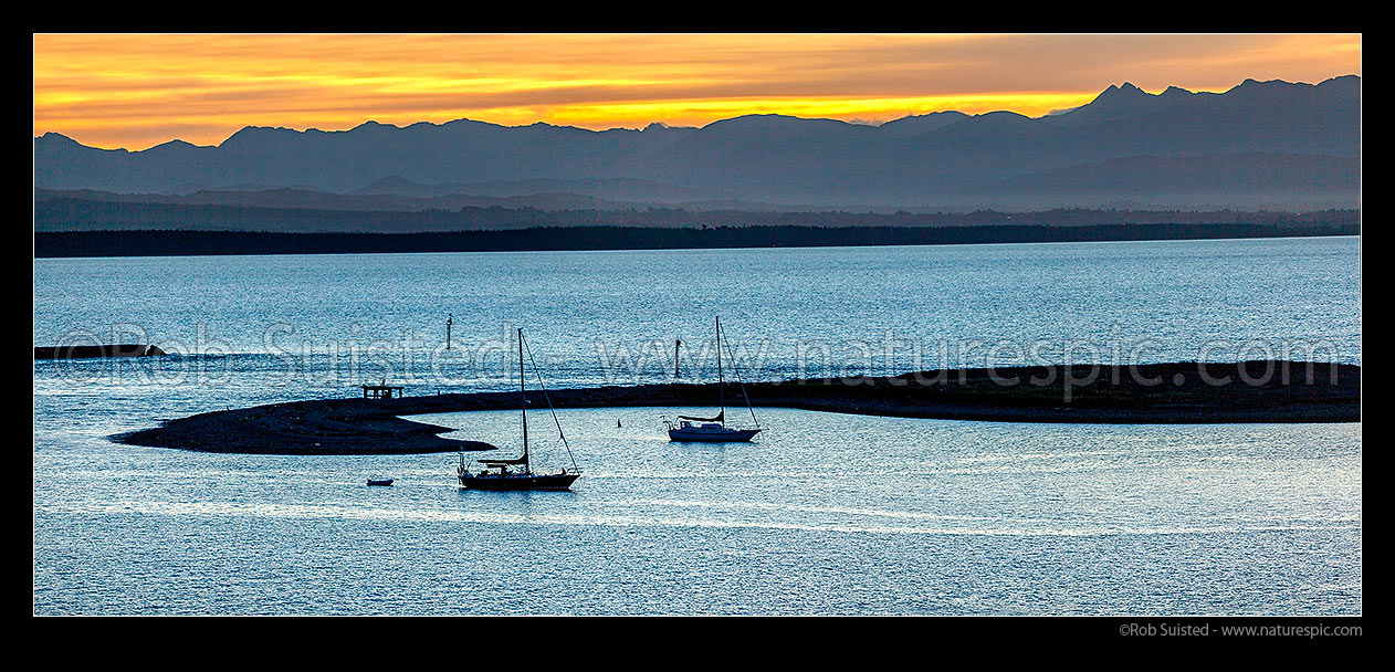 Image of Sailboats moored in Nelson Haven inside the Boulder Bank of Tasman Bay, at dusk. Panorama, Nelson, Nelson City District, Nelson Region, New Zealand (NZ) stock photo image