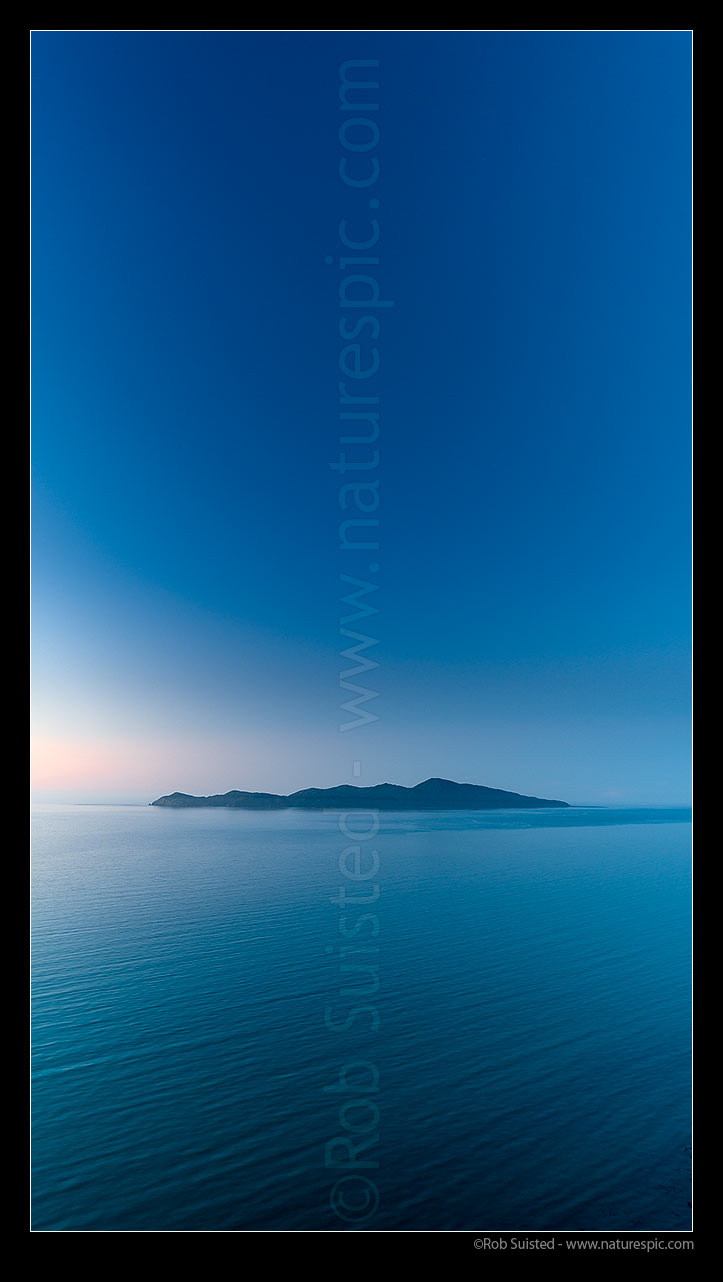 Image of Kapiti Island at dusk. Vertical panorama, Paekakariki, Kapiti Coast District, Wellington Region, New Zealand (NZ) stock photo image