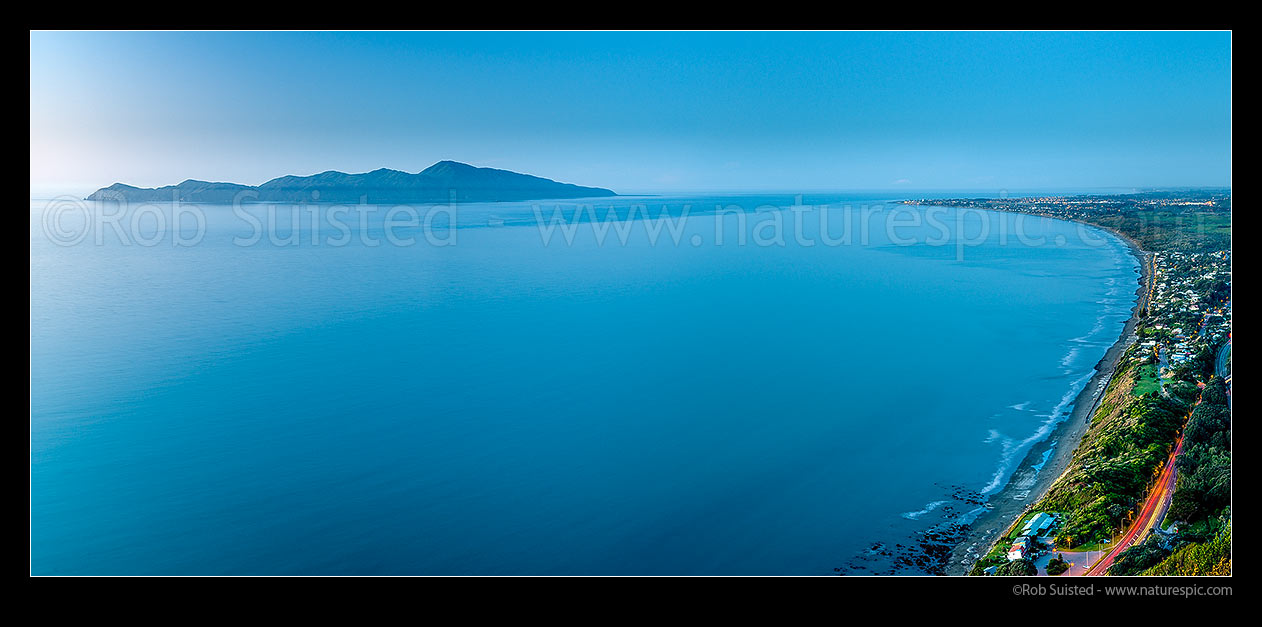 Image of Kapiti Island seen from Paekakariki Hill at dusk. Rauoterangi Channel and Otaheke Strait separate the island from Paraparaumu Beach. Panorama, Paekakariki, Kapiti Coast District, Wellington Region, New Zealand (NZ) stock photo image