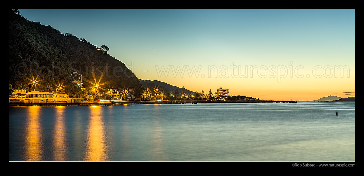 Image of Days Bay and Eastbourne at Sunset. Wellington Harbour entrance and Seaward Kaikoura Ranges distant right. Panorama, Days Bay, Hutt City District, Wellington Region, New Zealand (NZ) stock photo image