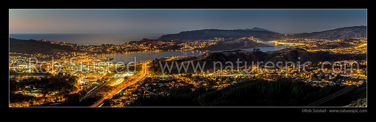 Image of Porirua City and Harbour sunset. Titahi Bay centre top, Cannons Creek, Waitangirua and Porirua East right. Plimmerton, Paremata and Kapiti Island distant. Panorama, Porirua, Porirua City District, Wellington Region, New Zealand (NZ) stock photo image