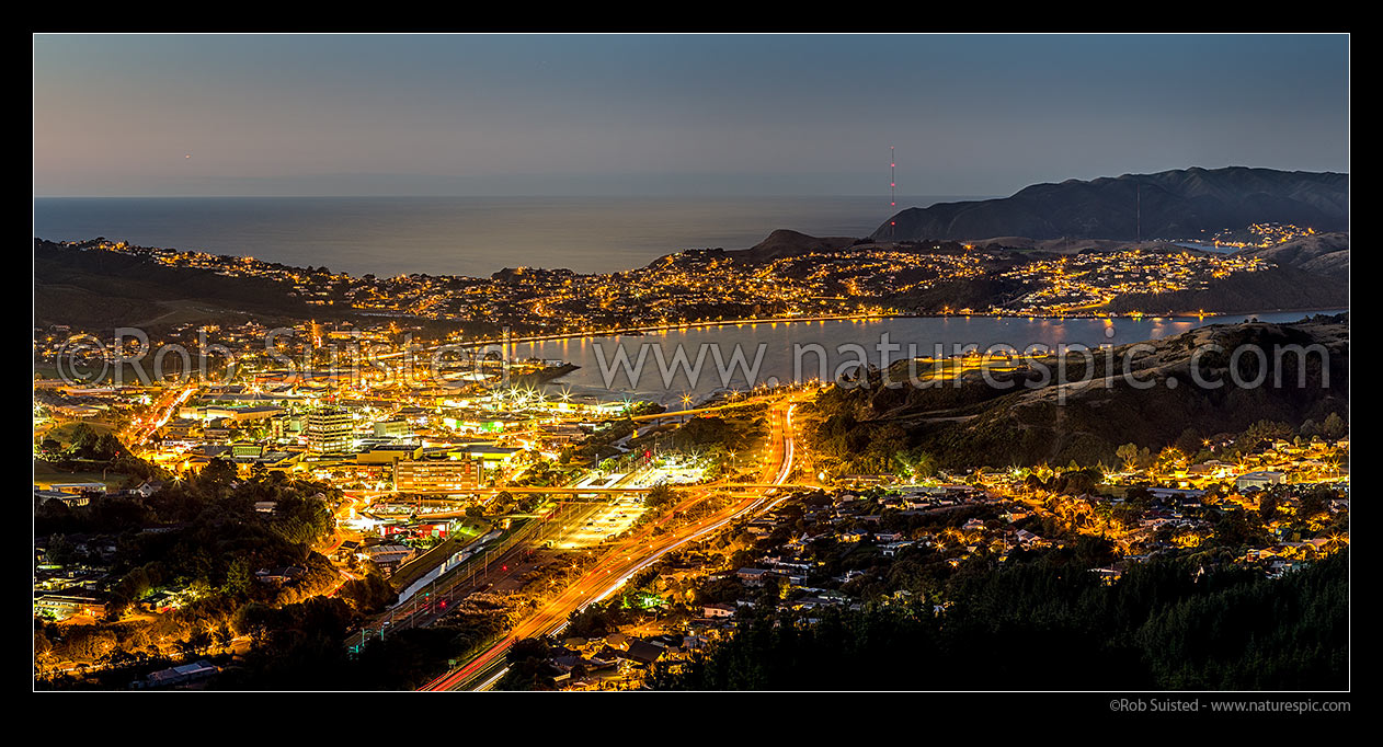 Image of Porirua City and harbour after sunset. Porirua East, Ranui Heights foreground right, Titahi Bay beyond. Panorama, Porirua, Porirua City District, Wellington Region, New Zealand (NZ) stock photo image