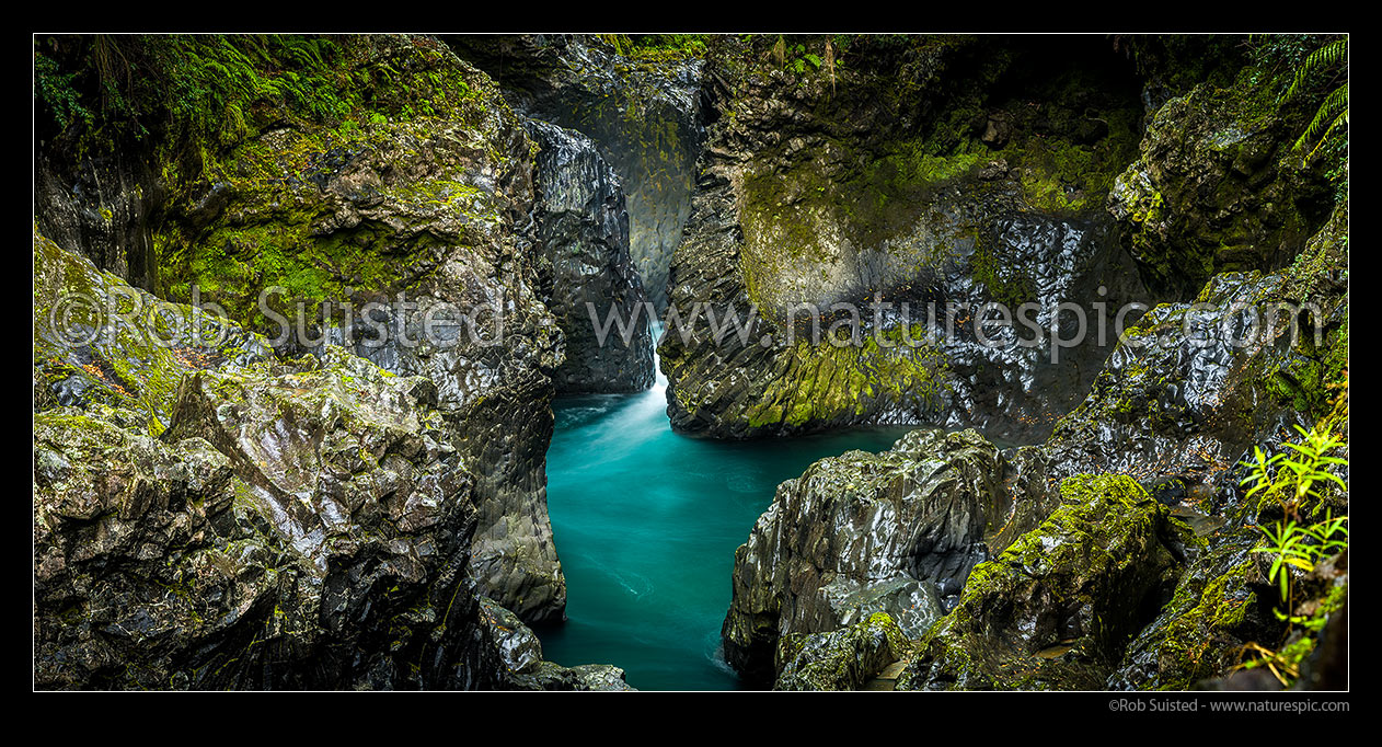 Image of Tongariro River in rugged water worn basalt rock gorge with moss and ferns. Panorama, Kaimanawa Forest Park, Taupo District, Waikato Region, New Zealand (NZ) stock photo image