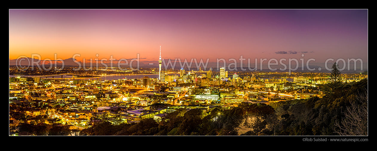 Image of Auckland city at night. Auckland Harbour Bridge far left, Sky Tower left and Hauraki Gulf far right. Very large panorama, Auckland, Auckland City District, Auckland Region, New Zealand (NZ) stock photo image