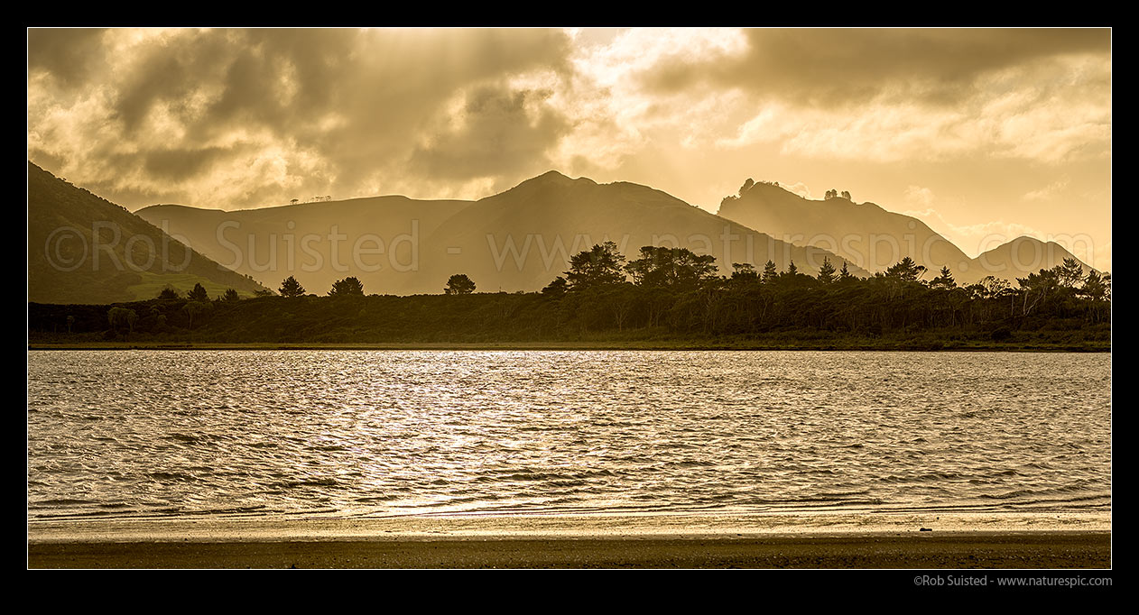 Image of Whangape Harbour on a stormy moody evening. Panorama. Proctor Peninsula in foreground, Pawarenga, Far North District, Northland Region, New Zealand (NZ) stock photo image