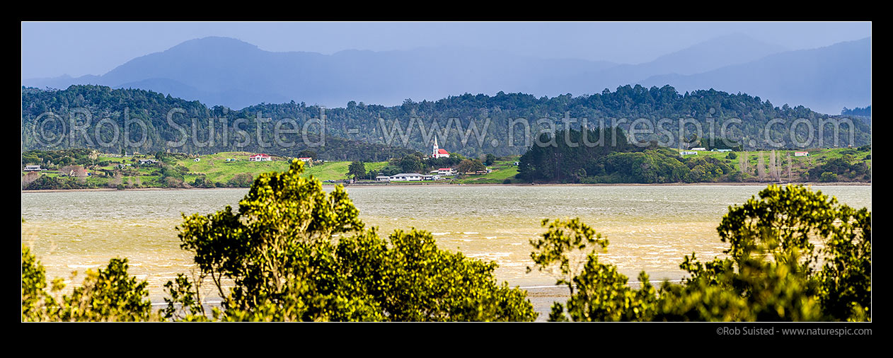 Image of Motukaraka Church. Catholic Church of Our Lady of the Assumption, historic Gothic style church built at Motukaraka Point in 1910 overlooking Rawene. Panorama with Panguru Range behind, Motukaraka, Hokianga Harbour, Far North District, Northland Region, New Zealand (NZ) stock photo image