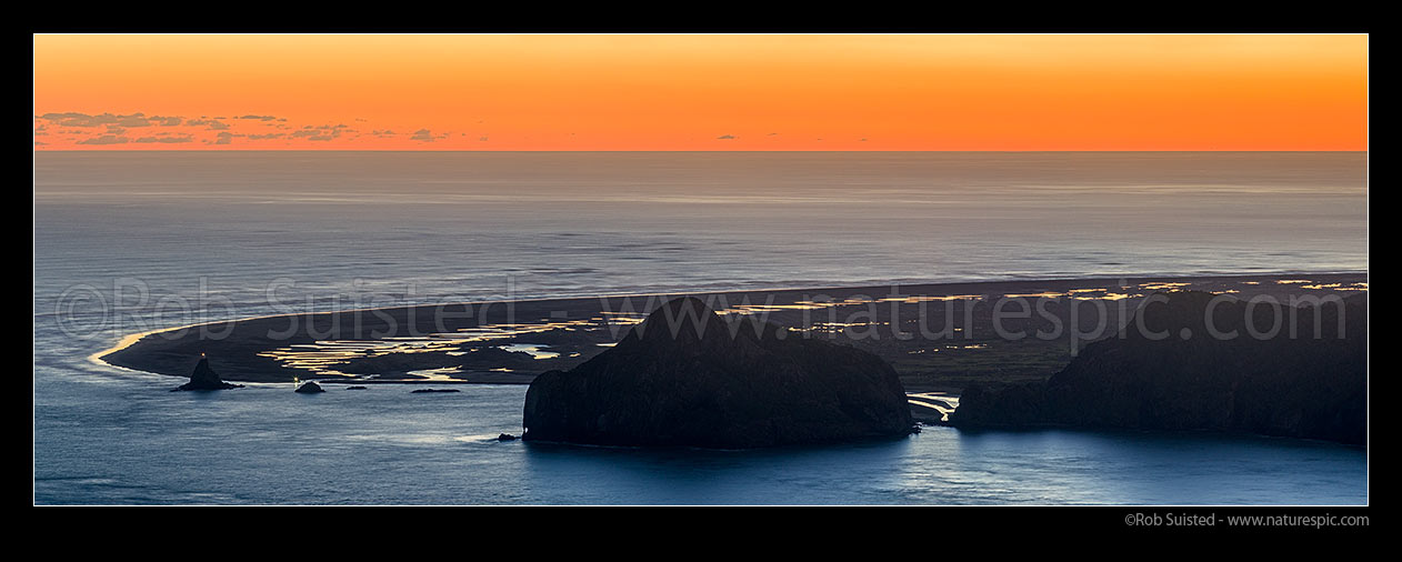 Image of Whatipu Beach and Manukau Harbour entrance. Ninepin Rock light far left and Paratutae Island centre. Wongawonga Bay right. Panaroma at sunset, Whatipu, Waitakere City District, Auckland Region, New Zealand (NZ) stock photo image