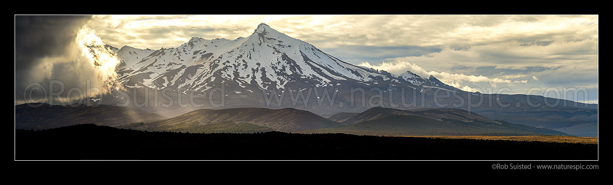 Image of Mt Ruapehu (2797m) with storm weather gathering from the South. Rangipo Desert and Desert Road. Seen from SH1. Panorama towards Tukino, Waiouru, Ruapehu District, Manawatu-Wanganui Region, New Zealand (NZ) stock photo image