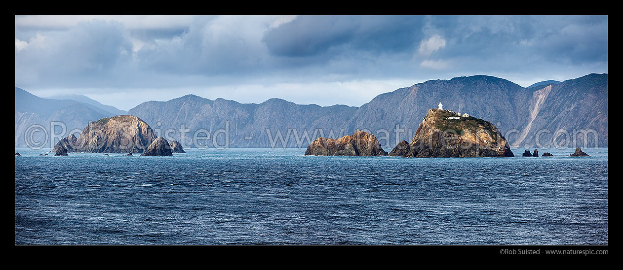 Image of The Brothers Islands in Cook Strait. Brothers lighthouse on North Group, with South Group at left. Arapaoa (Arapawa) Island behind, Marlborough Sounds, Marlborough District, Marlborough Region, New Zealand (NZ) stock photo image