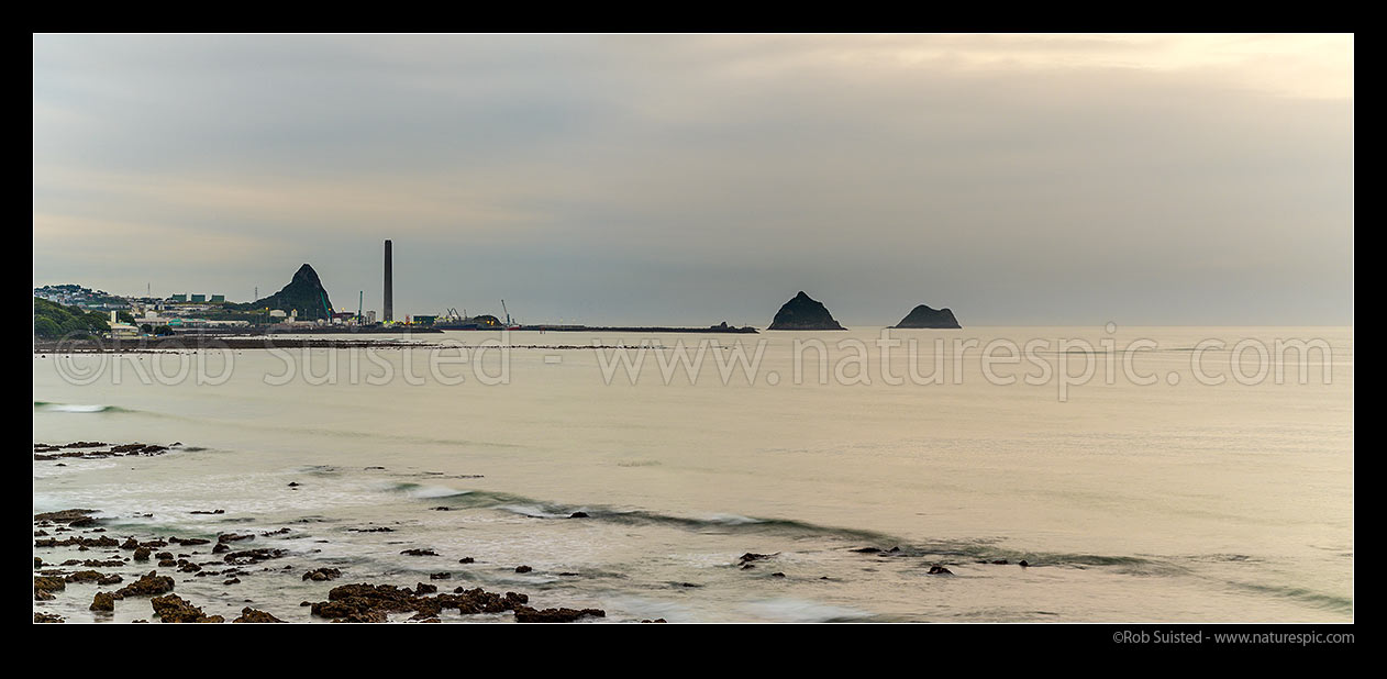 Image of New Plymouth foreshore with Port Taranaki, power station and Sugar Loaf Islands. Evening long exposure. Panorama, New Plymouth, New Plymouth District, Taranaki Region, New Zealand (NZ) stock photo image