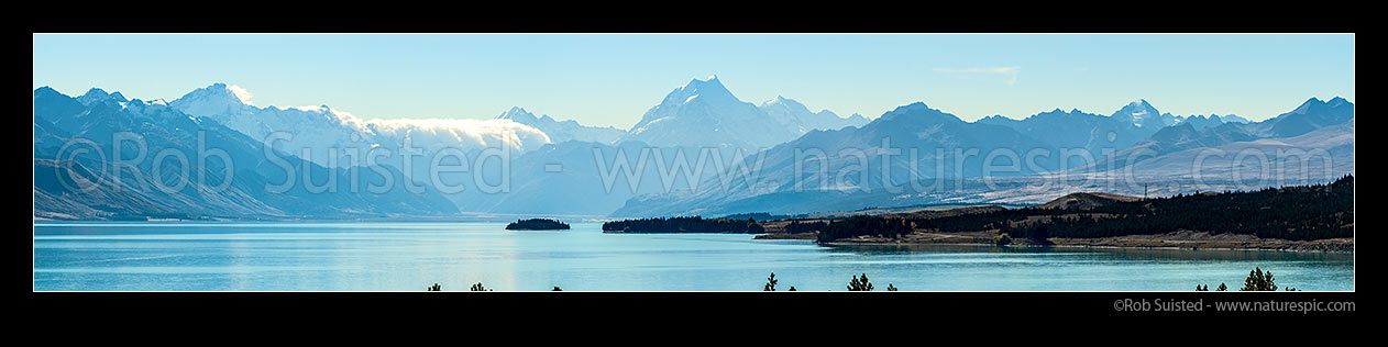 Image of Aoraki Mt Cook (3754m, at right) above Lake Pukaki. Tasman Valley above Morgans Island.  Mt La Perouse (3078m) centre left, and Mt Sefton left (3151m). Burnett Mountains right. Panorama, Aoraki / Mount Cook National Park, MacKenzie District, Canterbury Region, New Zealand (NZ) stock photo image