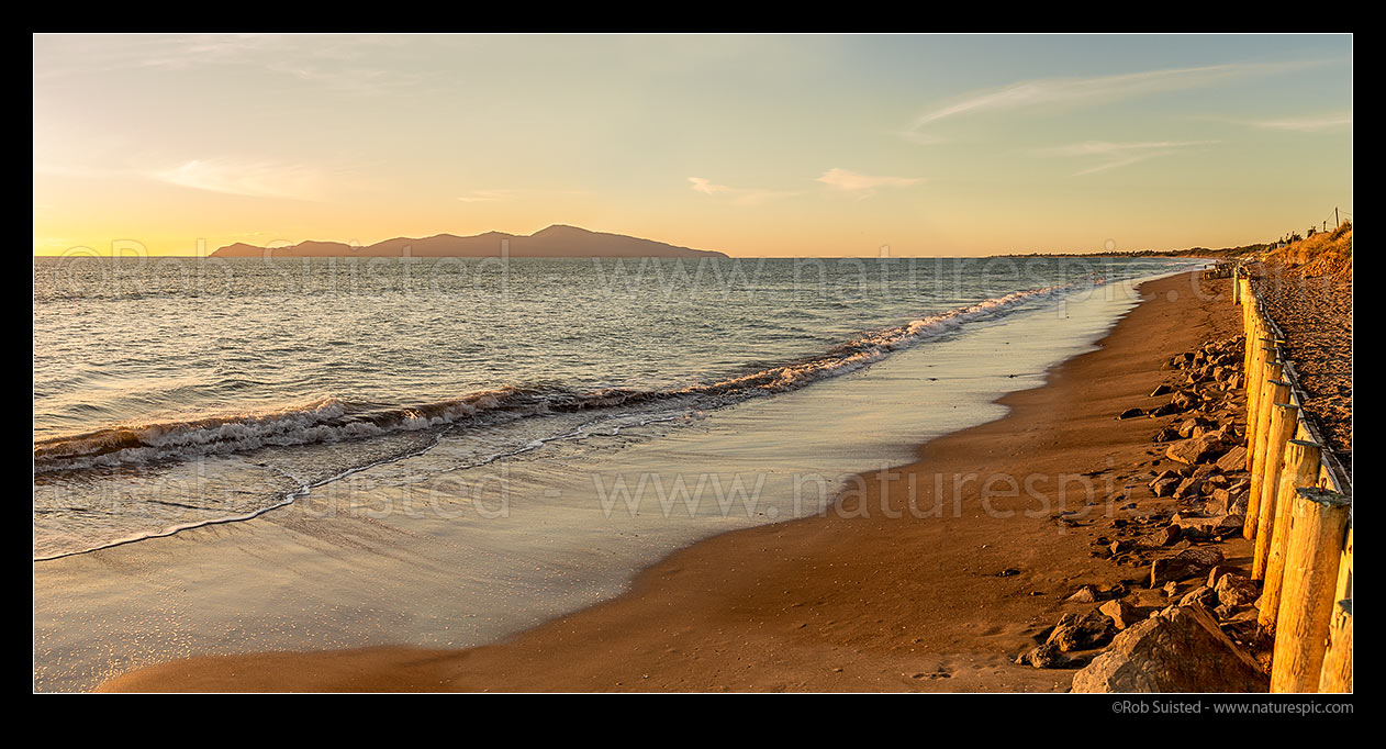 Image of Paekakariki's Whareroa Beach and Kapiti Island at sunset. Panorama, Paekakariki, Kapiti Coast District, Wellington Region, New Zealand (NZ) stock photo image