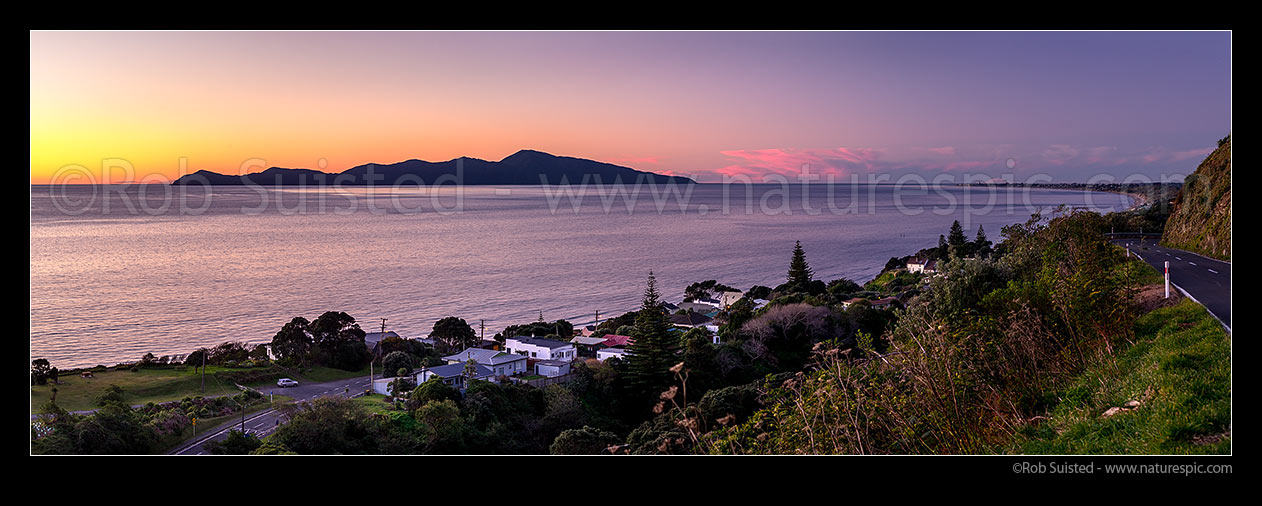 Image of Kapiti Island Nature Reserve offshore from Paekakariki township. Paekakariki Hill Road at right. Paraparaumu and Mt Ruapehu right distance. Panorama, Paekakariki, Kapiti Coast District, Wellington Region, New Zealand (NZ) stock photo image