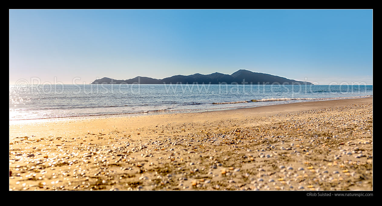 Image of Kapiti Island Nature Reserve, seen from Paekakariki on a glistening sunny day. Panorama, Paekakariki, Kapiti Coast District, Wellington Region, New Zealand (NZ) stock photo image