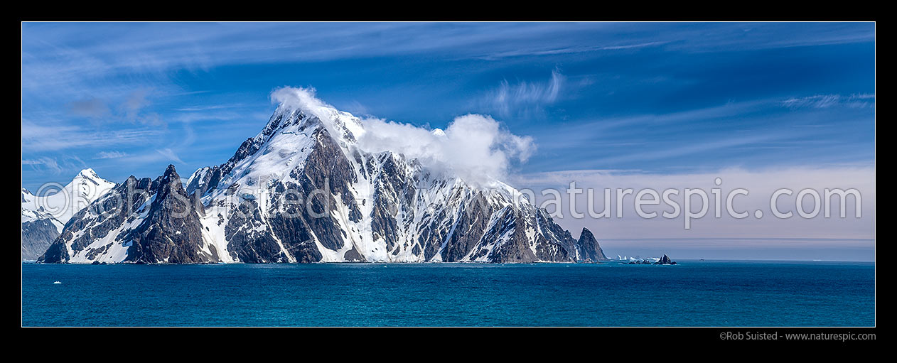 Image of Elephant Island, ice-covered mountainous island in the outer reaches of the South Shetland Islands.  Cape Valentine prominent at left. Seen from the east. Panorama, Elephant Island, Antarctica Region, Antarctica stock photo image