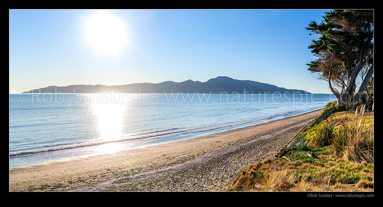 Image of Kapiti Island and Raumati Beach foreshore panorama. Kapiti Island Nature Reserve, Raumati Beach, Kapiti Coast District, Wellington Region, New Zealand (NZ) stock photo image