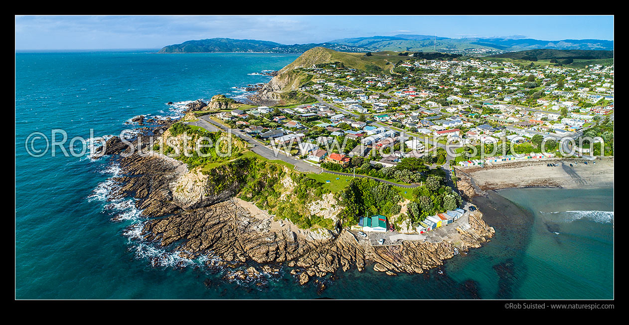 Image of Titahi Bay Beach with iconic colourful boatsheds on foreshore, Titahi Bay, Porirua City District, Wellington Region, New Zealand (NZ) stock photo image