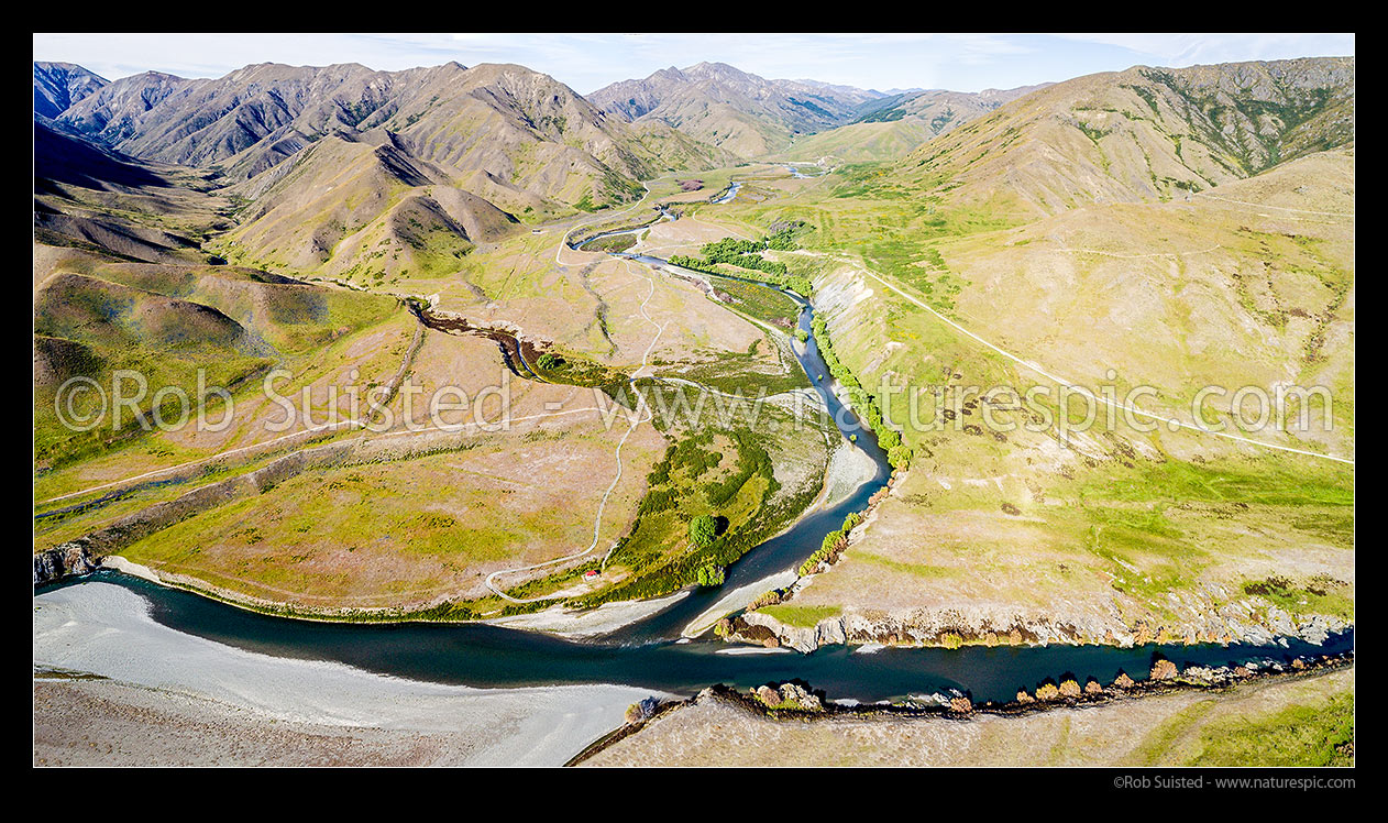 Image of Clarence River and Acheron River (bottom) confluence with the Hanmer Range and The Ribble Valley left, Acheron Accomodation House & campsite centre. Aerial view panorama, Molesworth Station, Marlborough District, Marlborough Region, New Zealand (NZ) stock photo image