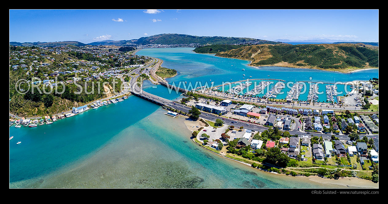 Image of Porirua Harbour, Mana, Paremata and Ivey Bay seen from above. Mana Marina right, with Titahi Bay beyond. Aerial panorama, Mana, Porirua City District, Wellington Region, New Zealand (NZ) stock photo image