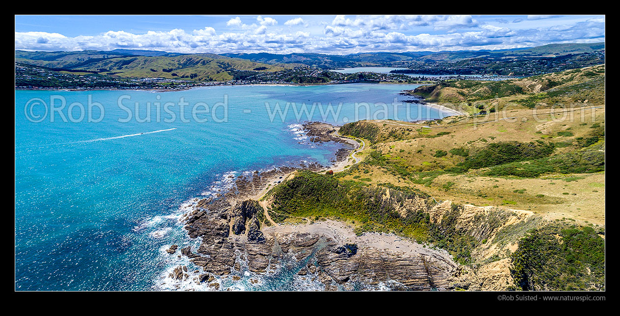 Image of Entrance to Porirua Harbour. Plimmerton at left, Onehunga Bay and Whitireia Park right, with Pauatahanui Inlet in distance. Aerial panorama, Titahi Bay, Porirua City District, Wellington Region, New Zealand (NZ) stock photo image