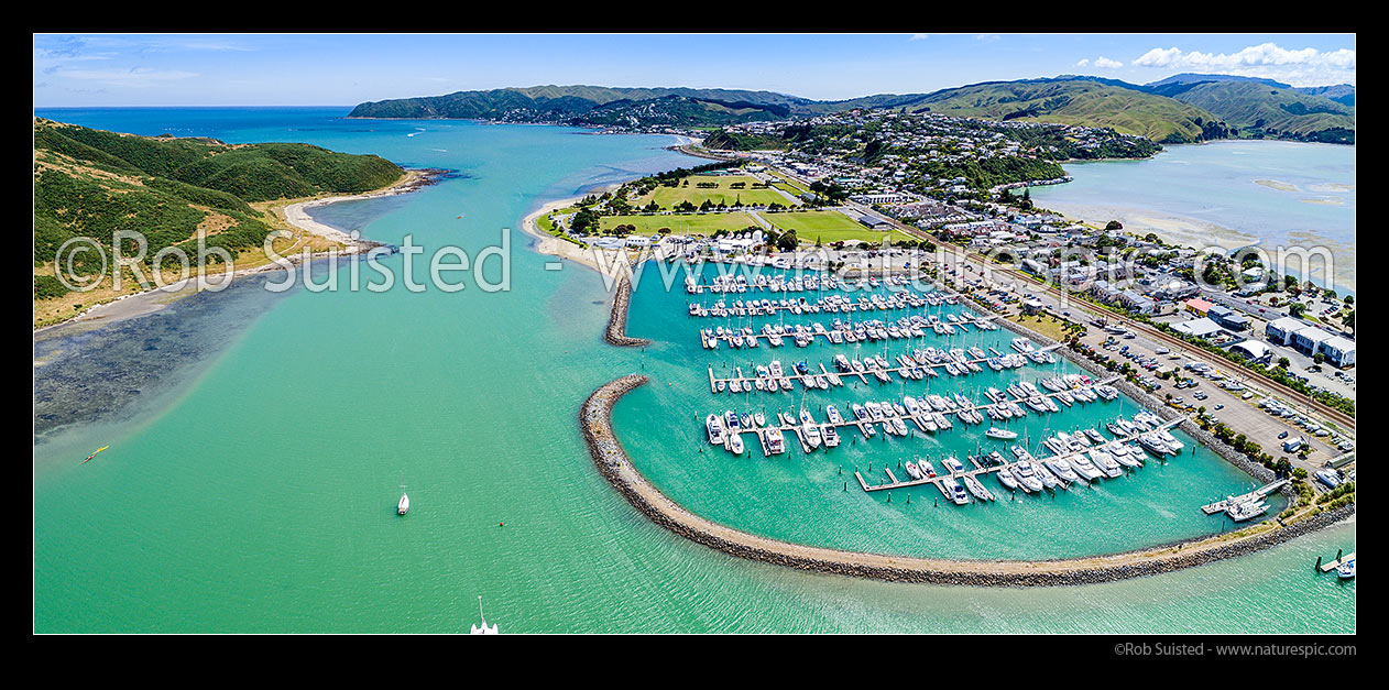 Image of Porirua Harbour entrance and Mana Marina, seen from Paremata. Suburbs of Mana, Camborne, and Plimmerton beyond. Whitireia Park at left. Aerial panorama, Paremata, Porirua City District, Wellington Region, New Zealand (NZ) stock photo image