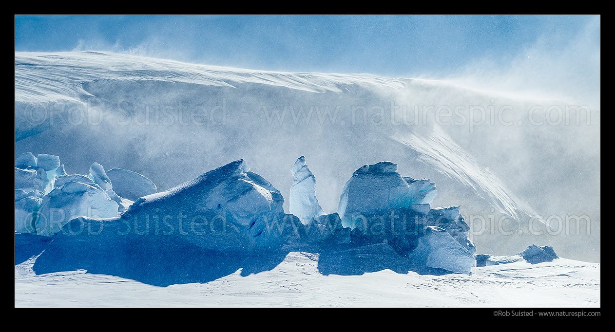 Image of Catabatic blizzard winds blow spindrift, snow and ice particles over the ice sheet and and pressure ridges below. Panorama, Ross Sea, Antarctica Region, Antarctica stock photo image