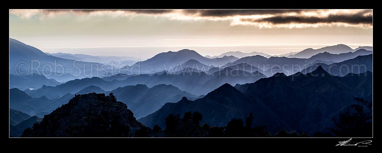 Image of Awatere River valley moody dawn, with ridgelines of Gladstone Downs and Camden Stations. Hodder River, Cam and Isis stream close by. Cook Strait beyond. Panorama, Awatere Valley, Marlborough District, Marlborough Region, New Zealand (NZ) stock photo image