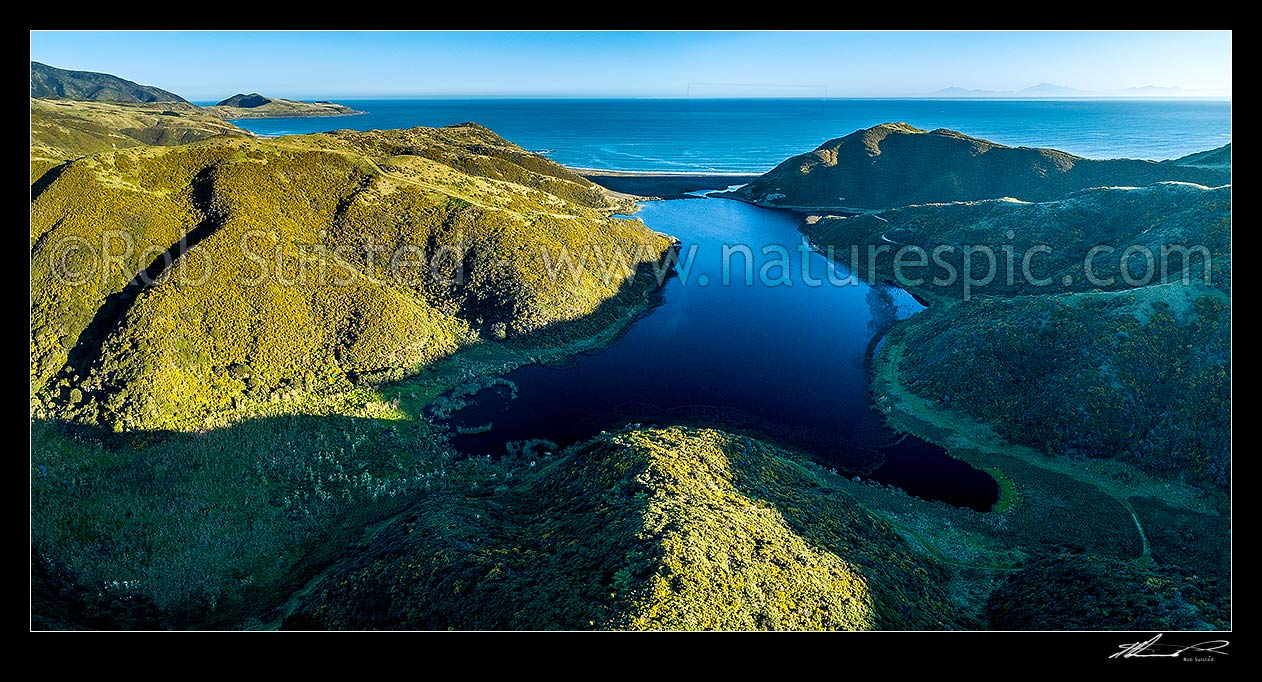 Image of Lake Kohangapiripiri in East Harbour Regional Park. Aerial panorama view with Baring Head far left. Lake Kohngapiripiri Wildlife Reserve, Pencarrow Head, Hutt City District, Wellington Region, New Zealand (NZ) stock photo image