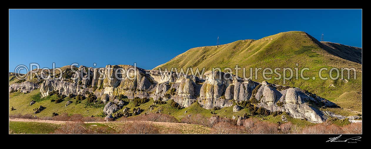 Image of Limestone outcrop and cliffs, at Weka Pass. Rural farmland panorama, Waikari, Hurunui District, Canterbury Region, New Zealand (NZ) stock photo image