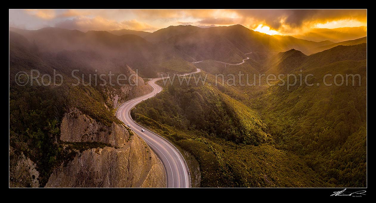 Image of Remutaka (Rimutaka) Hill Road (State Highway 2, SH2) climbing over the Remutaka (Rimutaka) Ranges (to 555m) from Upper Hutt to the Wairarapa. Aerial panorama on a moody evening, Remutaka, Upper Hutt City District, Wellington Region, New Zealand (NZ) stock photo image