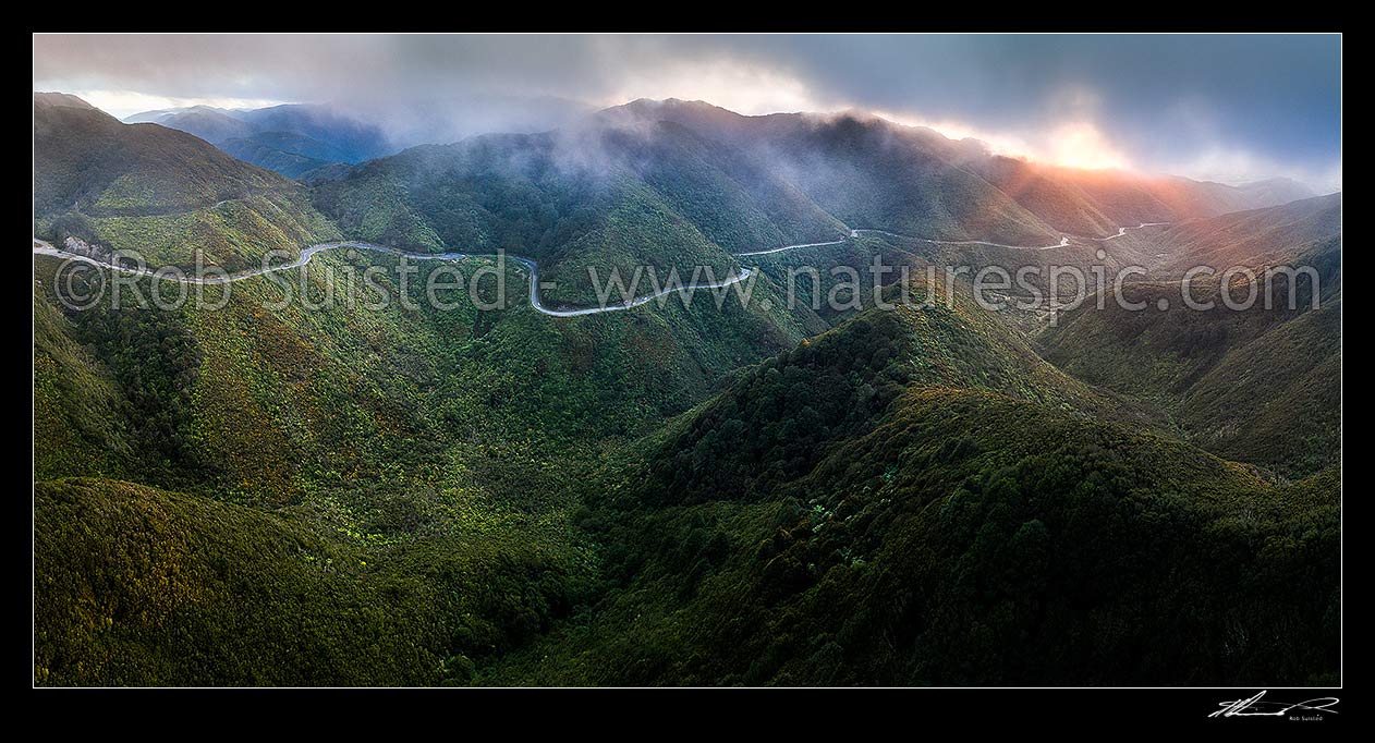 Image of Remutaka (Rimutaka) Hill Road (State Highway 2, SH2) climbing over the Remutaka (Rimutaka) Ranges (to 555m) from Upper Hutt to the Wairarapa. Aerial panorama on a moody evening, Remutaka, Upper Hutt City District, Wellington Region, New Zealand (NZ) stock photo image