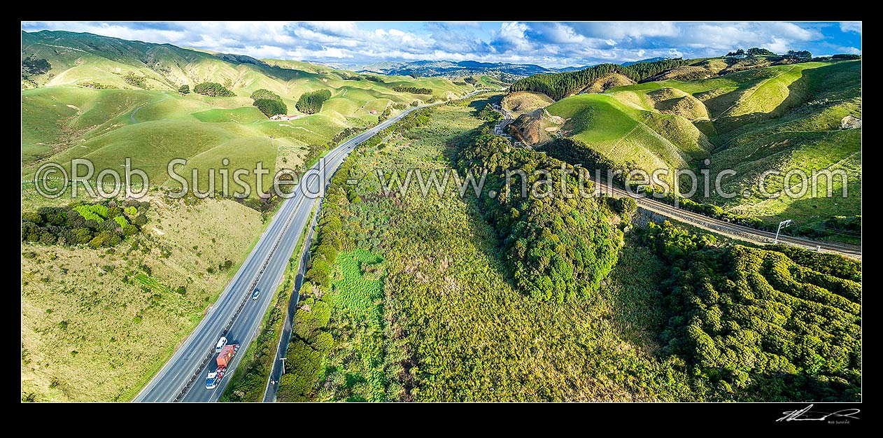 Image of Taupo Swamp, a protected wetland under the QEII National Trust. Taupo Stream, hemmed in by the NIMT railway line and State Highway 1 (SH1). Aerial panorama looking south to Porirua, Plimmerton, Porirua City District, Wellington Region, New Zealand (NZ) stock photo image