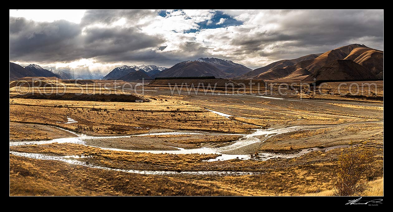 Image of Ahuriri River Valley at Ben Avon Station. Avon River confluence with the Ahuriri River at right. Heavy weather in the upper valley. Huxley Range and Ahuriri Conservation Park beyond. Panorama, Ahuriri River, Waitaki District, Canterbury Region, New Zealand (NZ) stock photo image