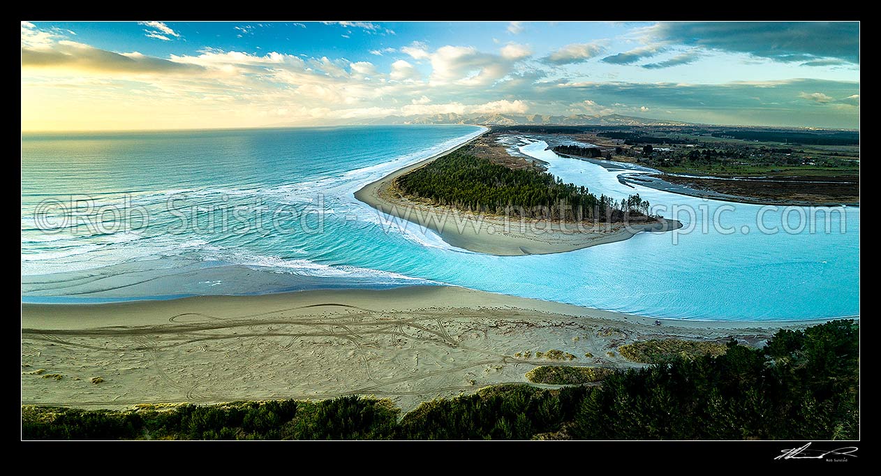 Image of Waimakariri River mouth, looking south towards Christchurch and the Port Hills. Brooklands Lagoon at right. Kairakai. Aerial panorama at dawn, Kaiapoi, Waimakariri District, Canterbury Region, New Zealand (NZ) stock photo image