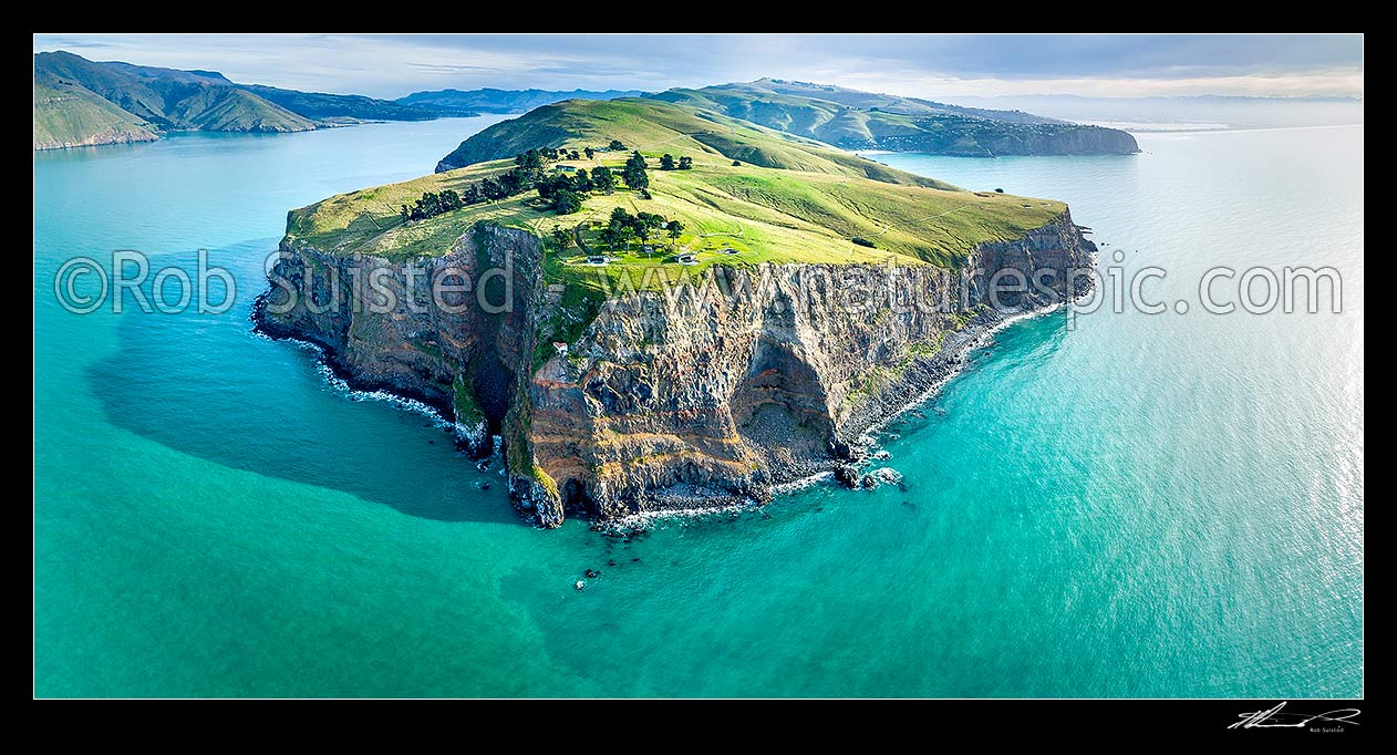 Image of Godley Head Awaroa at entrance of Lyttelton Harbour (Whakaraupo), left. Historic gun emplacements reserve centre. Sumner Head and Christchurch at right. Aerial panorama, Godley Head, Christchurch City District, Canterbury Region, New Zealand (NZ) stock photo image