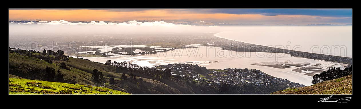 Image of Christchurch City panorama. Looking over the Heathcoate Avon estuary as weather change brings fog. Pegaus Bay and New Brighton Pier right. Seen from The Port Hills, Christchurch, Christchurch City District, Canterbury Region, New Zealand (NZ) stock photo image