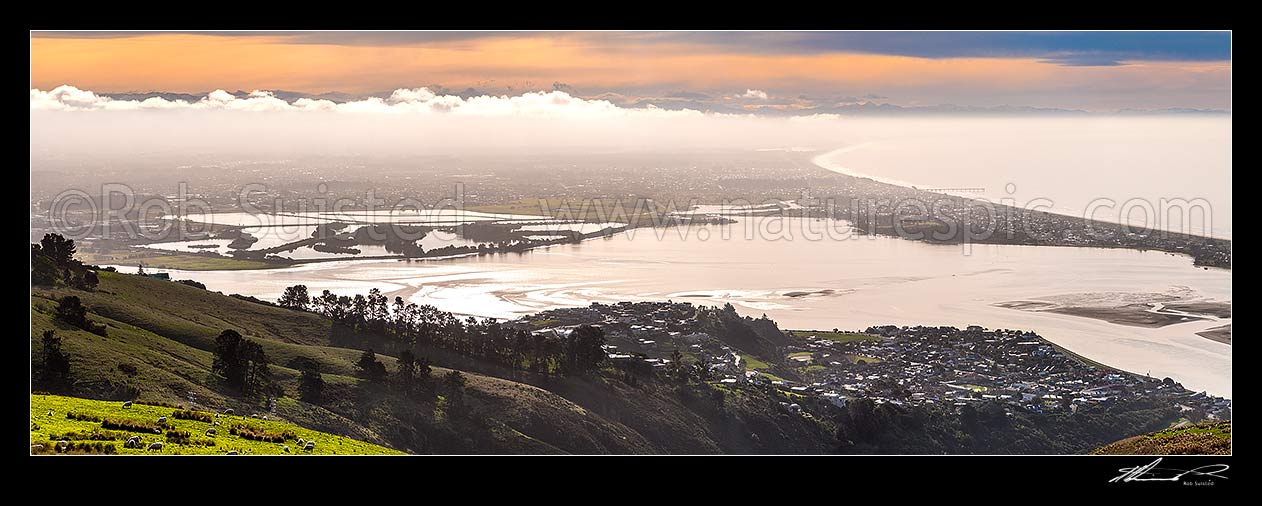 Image of Christchurch City panorama. Looking over the Heathcoate Avon estuary as weather change brings fog. Pegaus Bay and New Brighton Pier right. Seen from The Port Hills, Christchurch, Christchurch City District, Canterbury Region, New Zealand (NZ) stock photo image