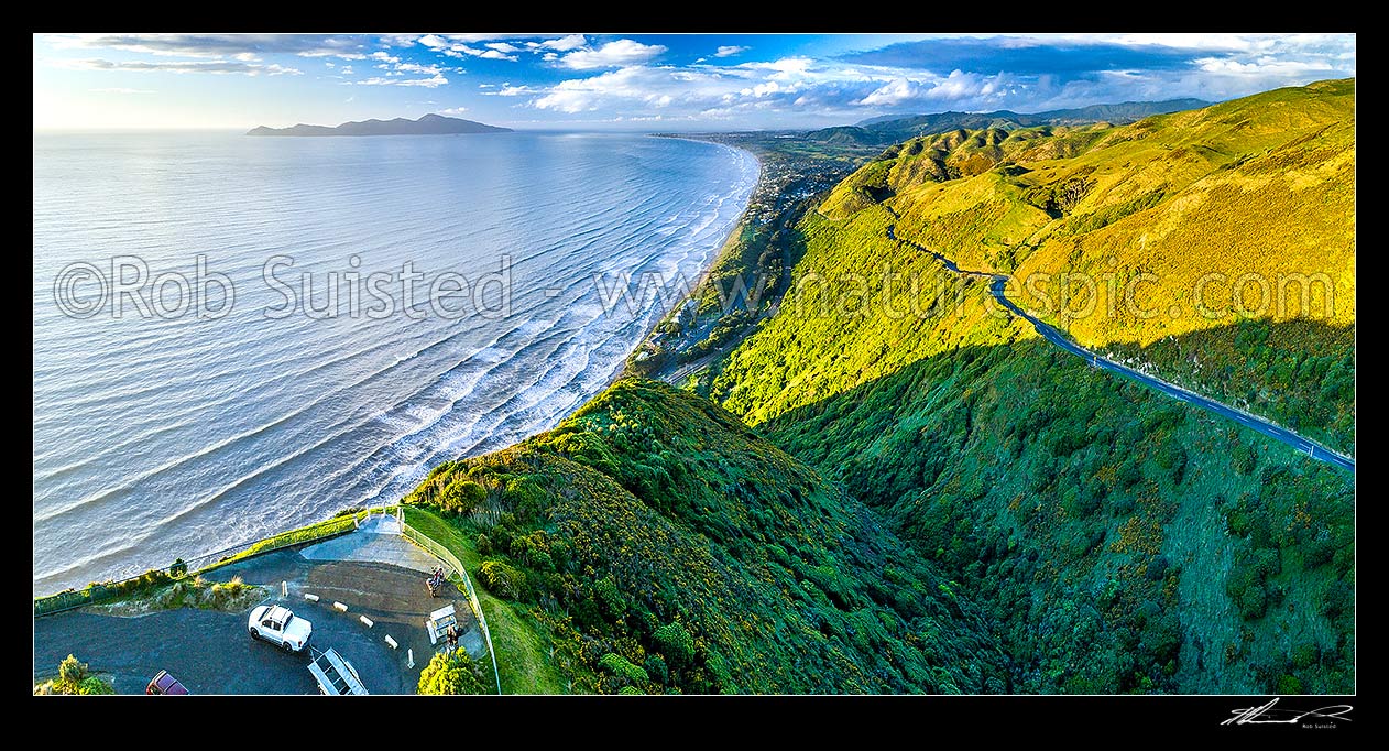 Image of Kapiti Coast evening, looking over the Paekakariki Hill Road lookout towards Kapiti Island Nature Reserve and Paekakariki village. Paraparaumu Beach beyond. Aerial panorama, Paekakariki, Kapiti Coast District, Wellington Region, New Zealand (NZ) stock photo image