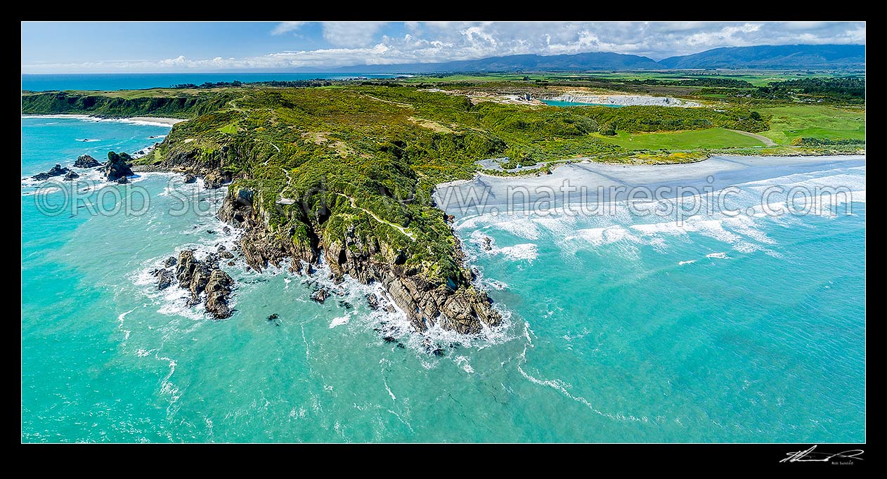 Image of Tauranga Bay Beach (right) and Cape Foulwind Walkway panorama. Aerial view, Cape Foulwind, Buller District, West Coast Region, New Zealand (NZ) stock photo image