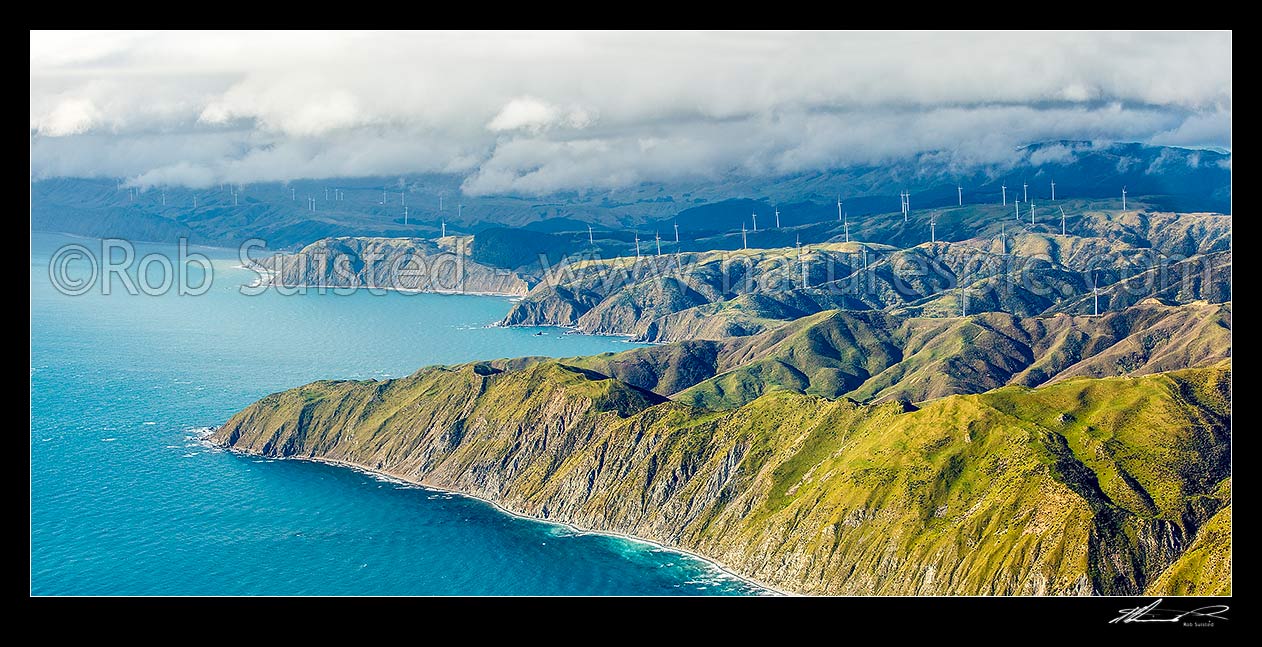 Image of Meridian Energy Project West Wind farm of 62 turbines at Terawhiti Station and Makara Farm west of Wellington. Ohau Point and Opau Bay left. Cape Terawhiti, aerial panorama, Makara, Wellington City District, Wellington Region, New Zealand (NZ) stock photo image