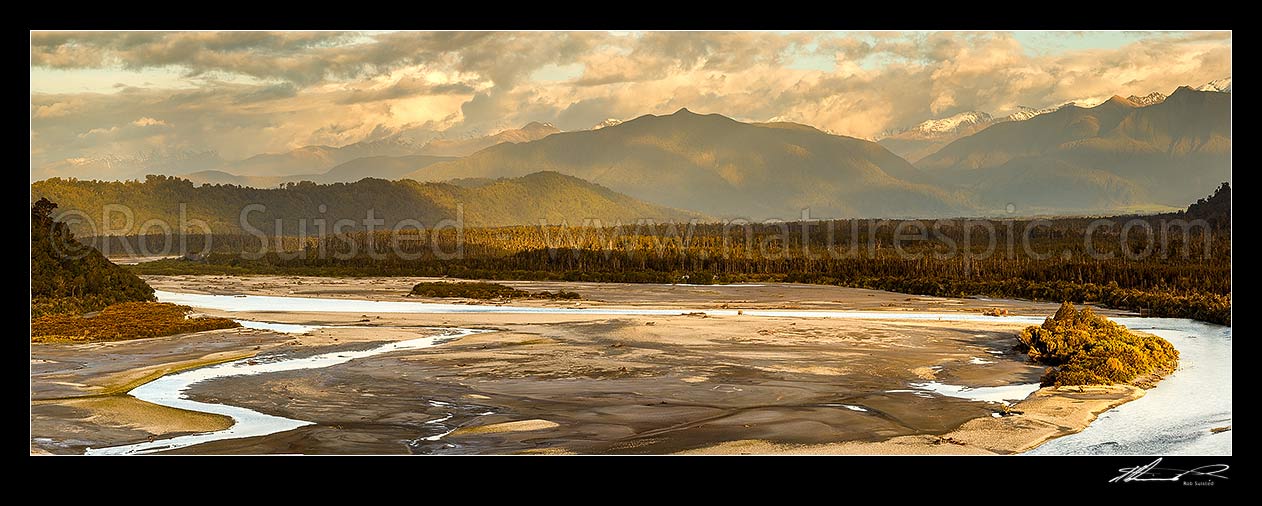 Image of Wanganui River in lower reaches, looking inland towards the Southern Alps from coast. Mt Bonar (1076m) centre right. Evening panorama, Harihari, Westland District, West Coast Region, New Zealand (NZ) stock photo image