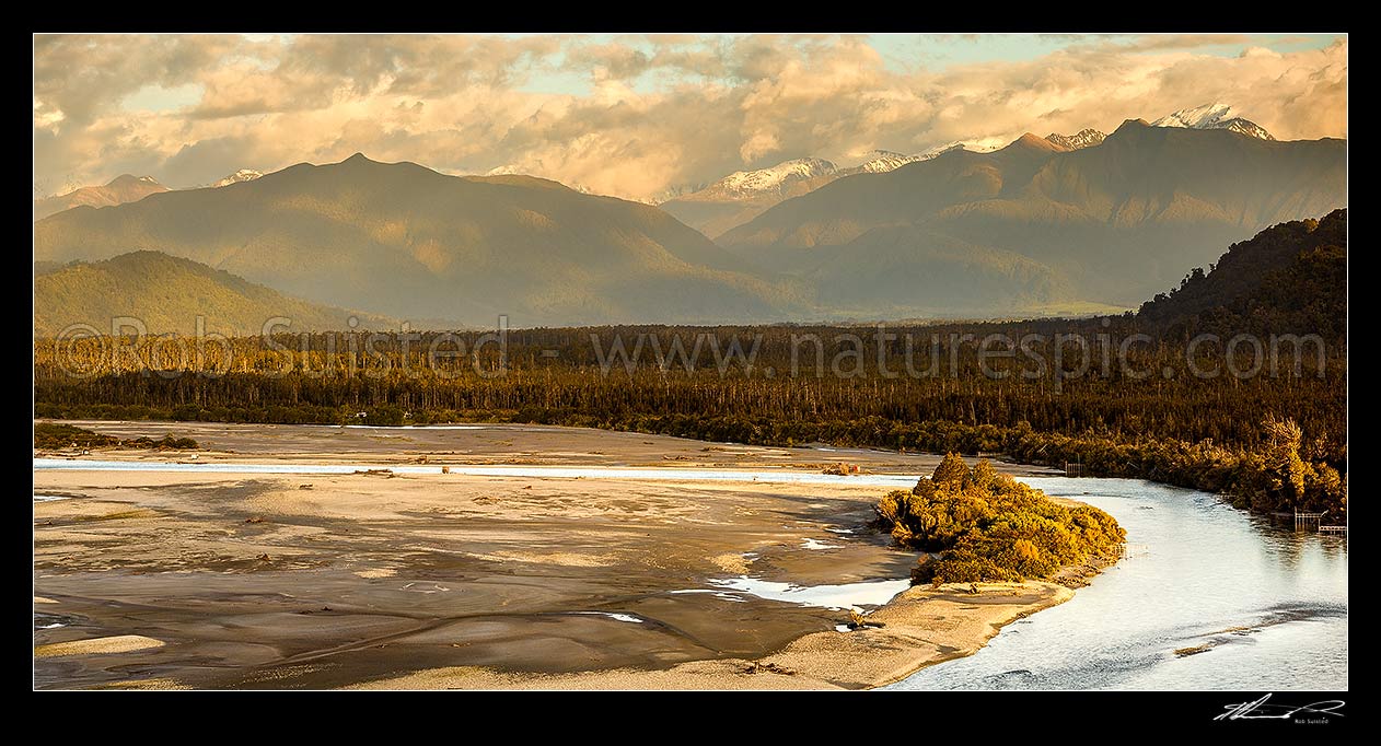 Image of Wanganui River in lower reaches and lowland forest, looking inland towards the Southern Alps from coast. Mt Bonar (1076m) left, and Symth Range right. Evening panorama, Harihari, Westland District, West Coast Region, New Zealand (NZ) stock photo image