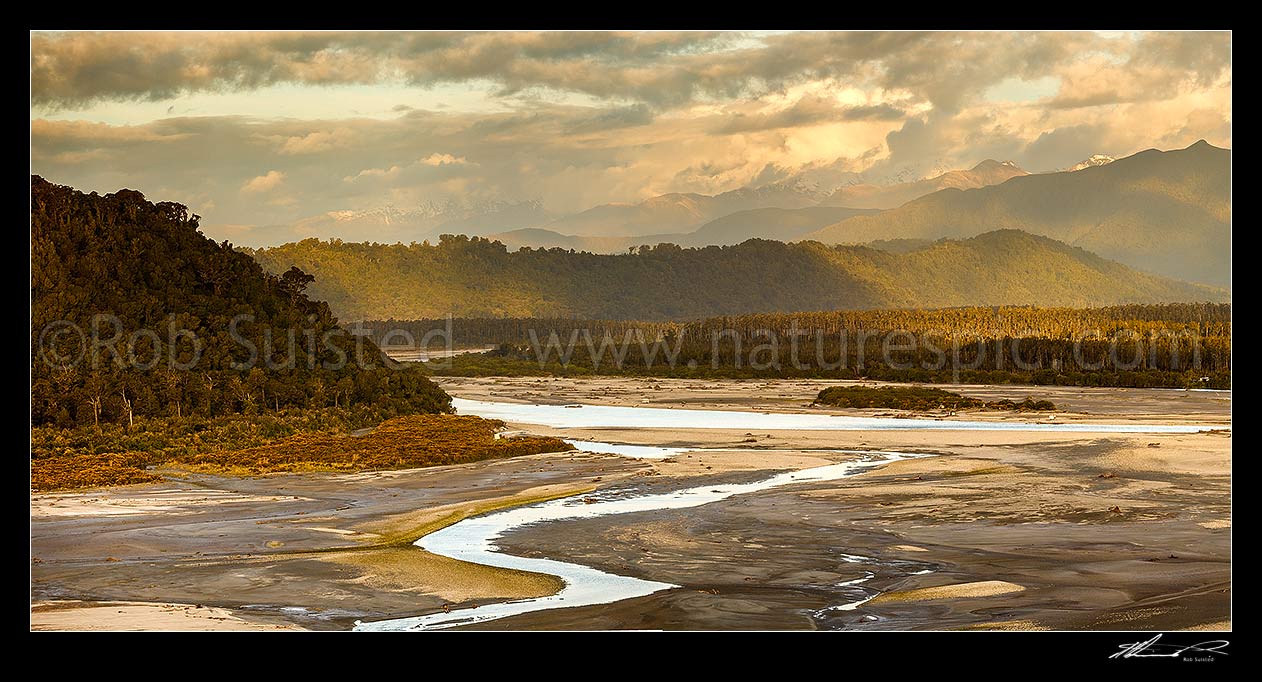 Image of Wanganui River in tidal lower reaches and lowland forest, looking inland towards the Southern Alps from coast. Mt Bonar (1076m) far right. Evening panorama, Harihari, Westland District, West Coast Region, New Zealand (NZ) stock photo image