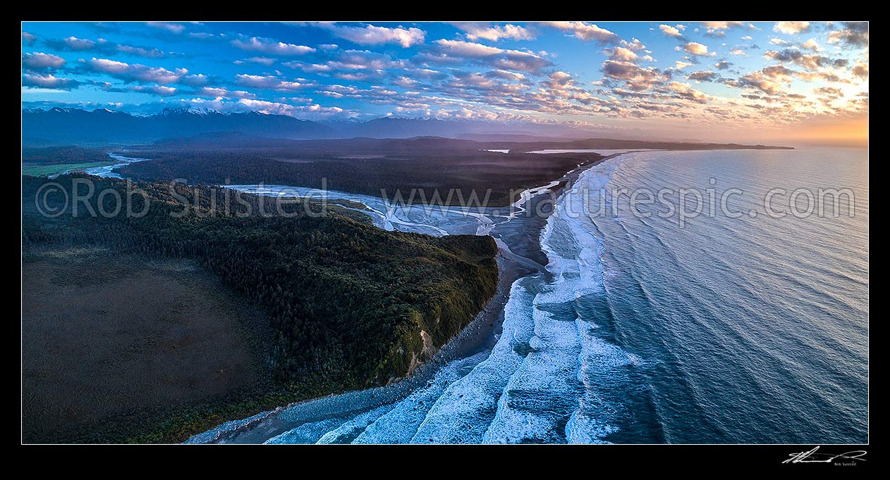 Image of Poerua River mouth in Westland, with Hikimutu Lagoon and Saltwater Lagoon visible. Abut Head far right. Southern Alps beyond, at dusk. Aerial panorama, Harihari, Westland District, West Coast Region, New Zealand (NZ) stock photo image