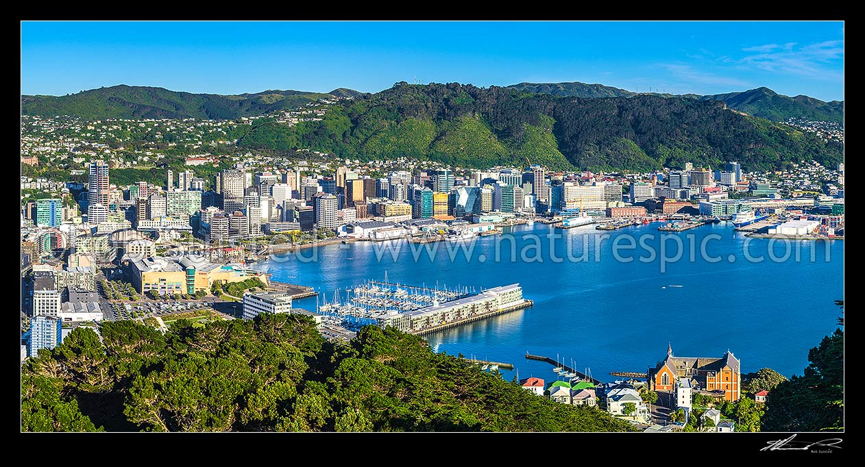 Image of Wellington City CBD, Lambton Harbour, Port and hillside suburbs seen from Mt Victoria. Clyde Quay Wharf centre, and St Gerards Monastry lower right. Panorama, Wellington, Wellington City District, Wellington Region, New Zealand (NZ) stock photo image